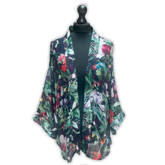 A floral kimono print short robe displayed on a mannequin. The robe is colorful with a mix of floral patterns.