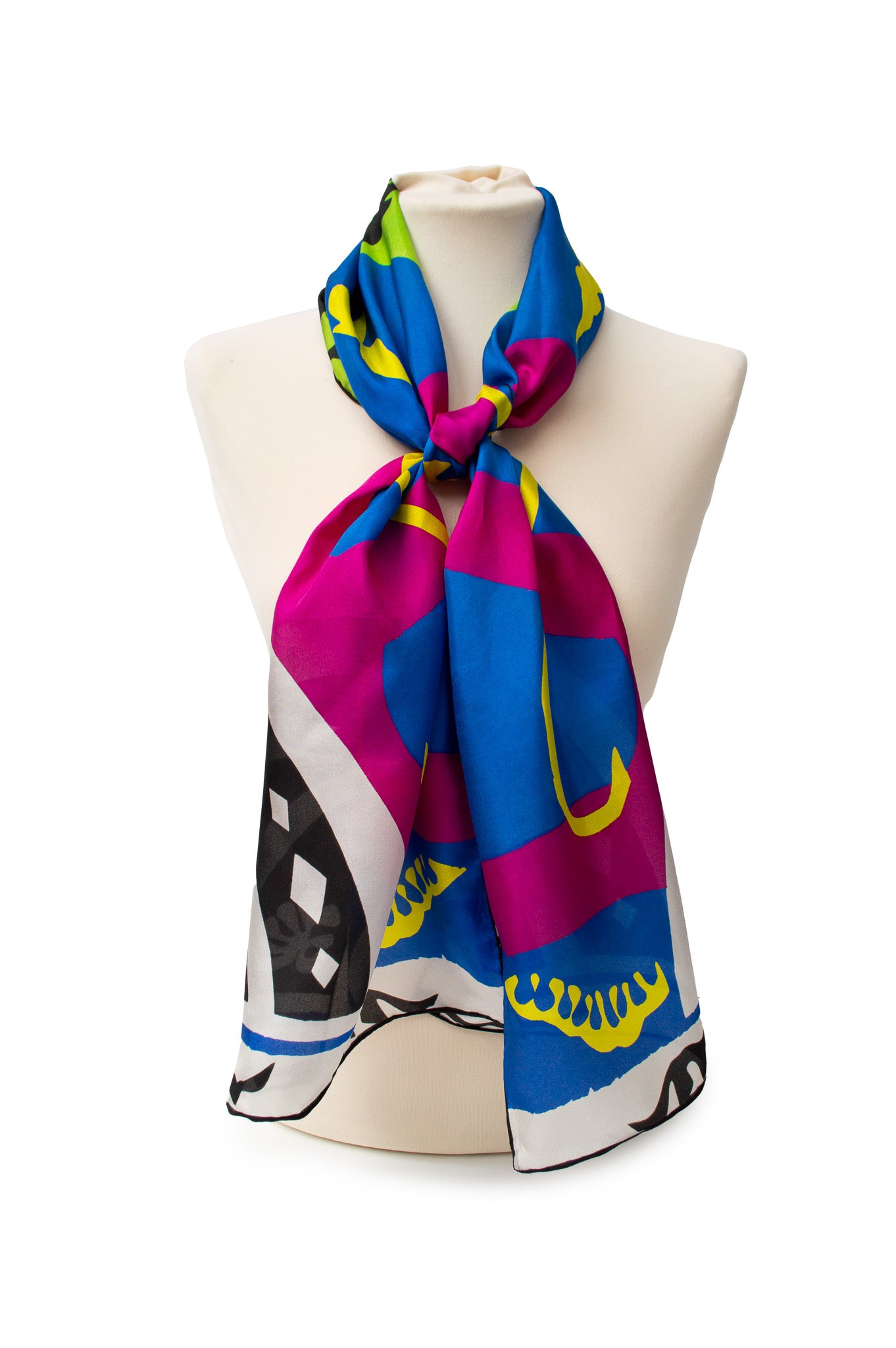 Colorful scarf with colourful patterns in blue, pink, yellow, black and white, on a mannequin against a white background.