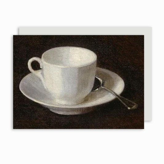 A greeting card featuring a still-life painting of a white cup and saucer with a spoon on a dark background.