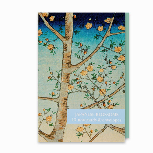 A notecard pack featuring a Japanese blossom artwork with a tree branch adorned with yellow flowers against a blue sky.