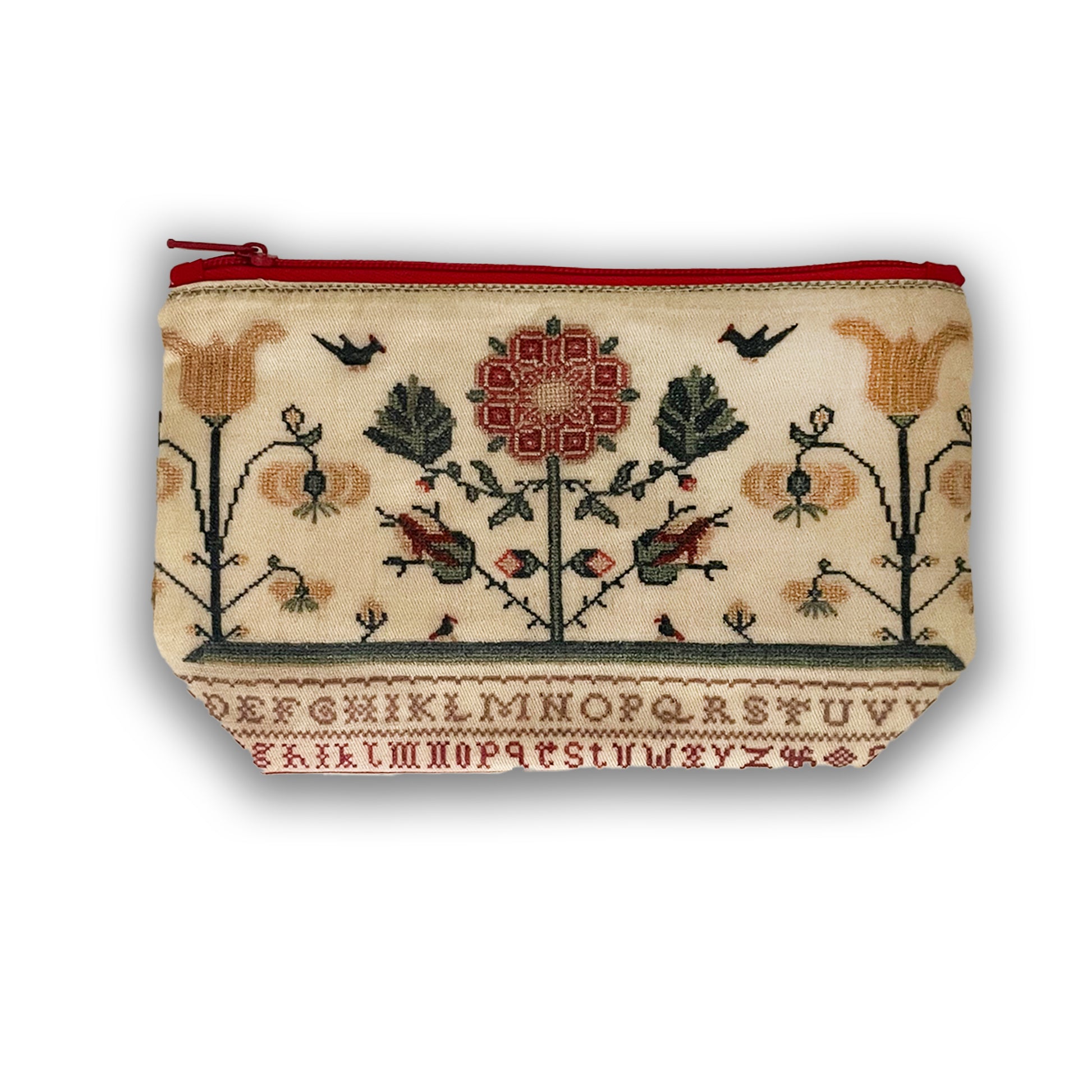 Small zipped cosmetic bag with sampler pattern and red zip.