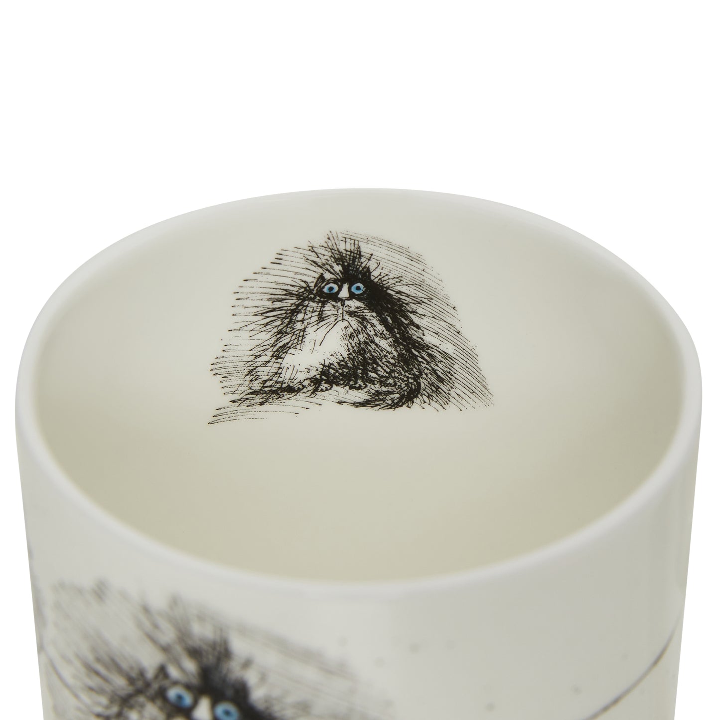 Interior of white bone china mug, showing grumpy cat detail in black line work. By Ronald Searle. From the collection of the Fitzwiliam Museum.