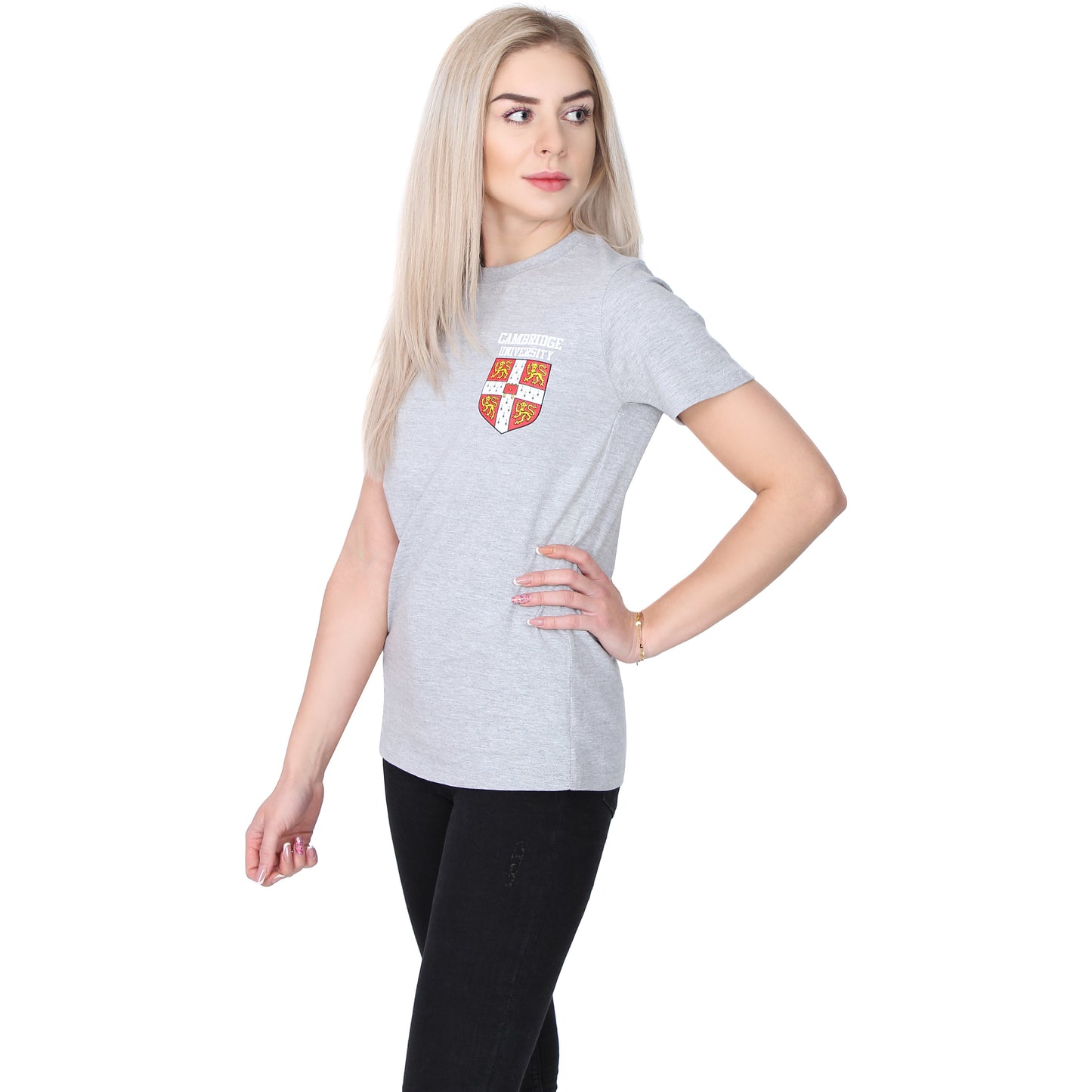 Female model wearing pale grey short sleeved T-shirt, with University of Cambridge shield in red, white, and yellow on the top left side. Brought to you by CuratingCambridge.com