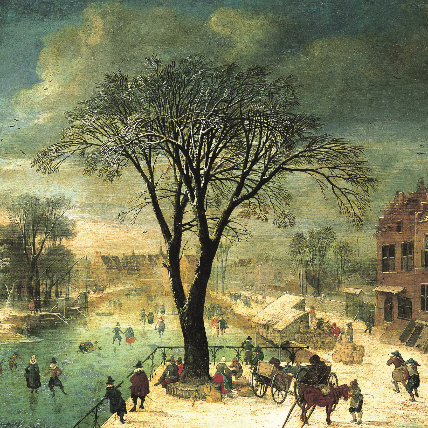 Square Christmas card - a central snowy tree in the middle of a Dutch city scene. Skaters on a frozen river to the left, a street with cards and pedestrians to the right. From the collection of The Fitzwilliam Museum, brought to you by CuratingCambridge.com