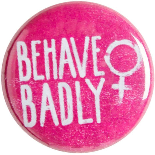 Pink pin badge with Behave Badly motto and female symbol. From the Rising Tide exhibition at Cambridge University Library, brought to you by CuratingCambridge.com