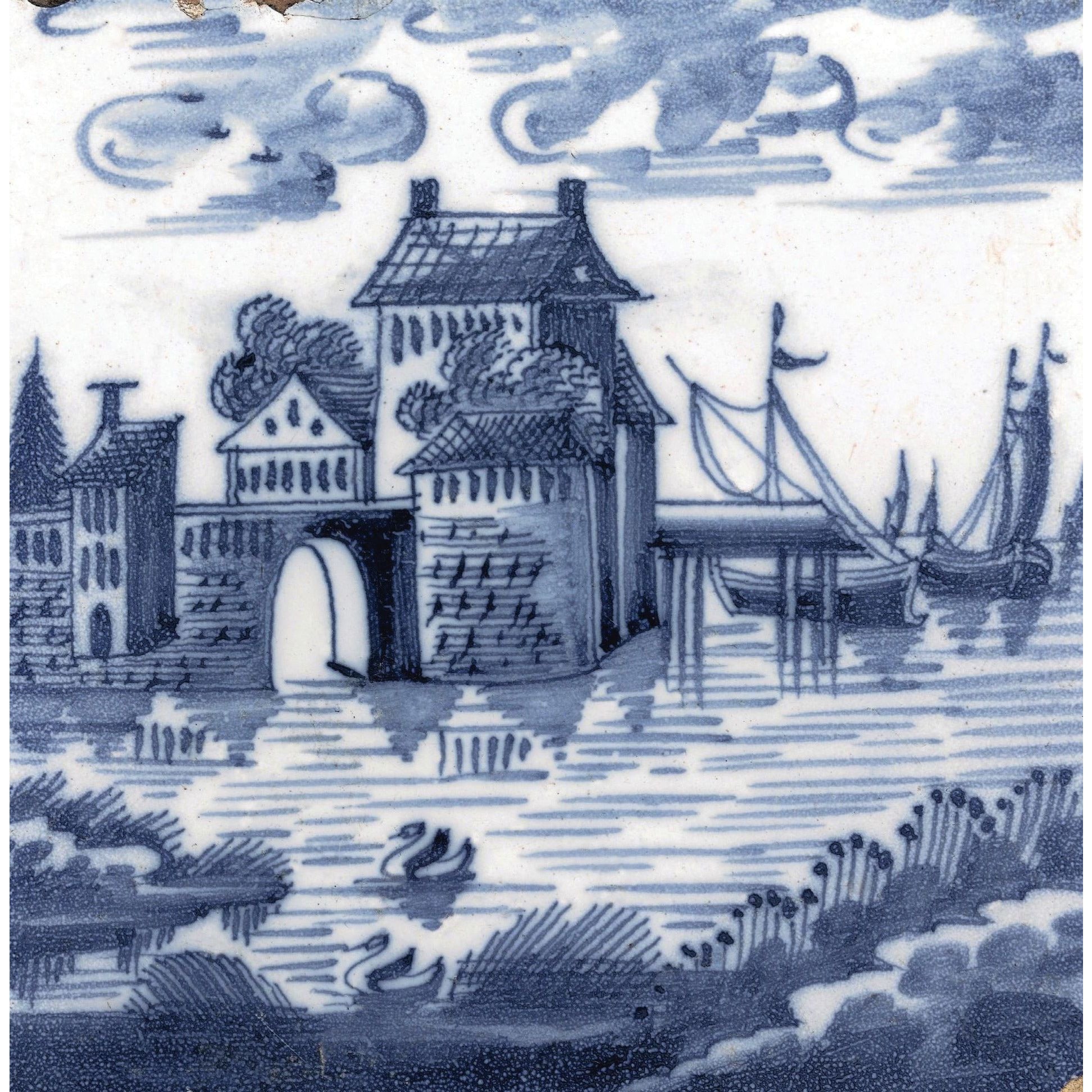 Square greeting card - blue and white tile with a river scene: houses, a bridge, and boats, with rushes and swans in the foreground. Dutch. From the collection of The Fitzwilliam Museum, brought to you by CuratingCambridge.com